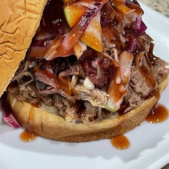 CNC Smokehouse - Pull pork sandwich with apple cranberry slaw and our glaze. - Food Trucks Near Me - Cypress, Texas CNC Smokehouse - Pull pork sandwich with apple cranberry slaw and our glaze. - Food Trucks Near Me - Cypress, Texas