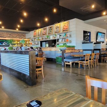 Ceviches by Divino ® Davie - View of the inside dining area and bar at the left side by the entrance. - Mexican Near Me - Davie, Florida Ceviches by Divino ® Davie - View of the inside dining area and bar at the left side by the entrance. - Mexican Near Me - Davie, Florida