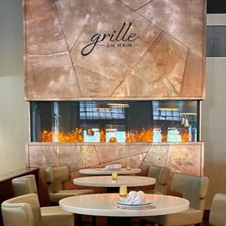 Bar tables and fireplace.