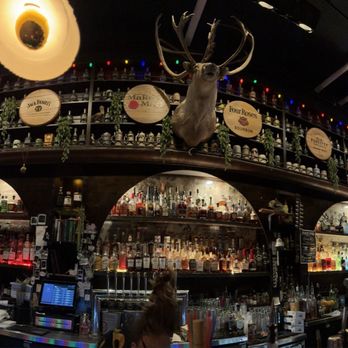 The Haberdasher - Looking behind the bar. Great selection of whiskey and bourbon - Cocktail Bars Near Me - Mobile, Alabama