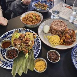 Dehls Gourmet - Waakye with goat, jollof rice, and cheese kattu