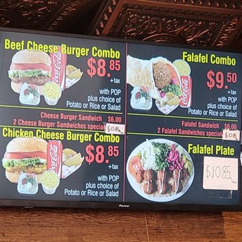 Tasty Shawarma - Menu - Menu board showing prices and options for beef cheese burger combo, falafel combo, chicken cheese burger, and falafel plate, with handwritten price notes. - Middle Eastern Near Me - Markham, Ontario