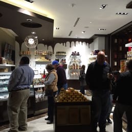 people shopping in a chocolate shop people shopping in a chocolate shop