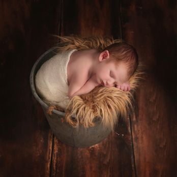 Laurie Brandt Photography - Baby comfortable in a bucket. - Event Photography Near Me