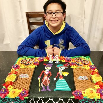 Piggly Wiggly - a boy sitting in front of a decorated cake - Grocery Near Me - Muskego, Wisconsin