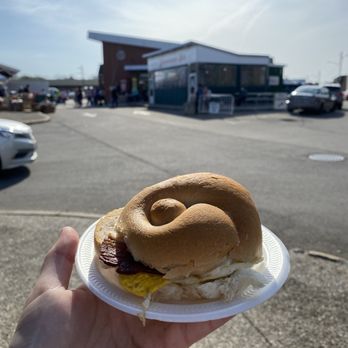 Zimmerman's - a person holding a plate with a sandwich on it - Breakfast & Brunch Near Me - Rochester, New York