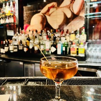 North Square - a cocktail sitting on a bar counter - New American Near Me - New York, New York North Square - a cocktail sitting on a bar counter - New American Near Me - New York, New York