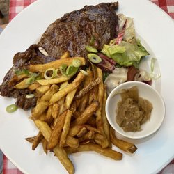 L'Industrie - The entrecôte -- served with excellent frites and carmelized onions. The most expensive item on the menu at €28
