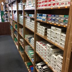 Tobacco City - The Great Wall of Cartons! Name brand products such Marlboro, Newport, Camel, Winston, Kool, and many more!
