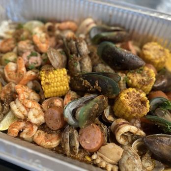 Shell Seafood Shack - a tray of seafood and corn - Seafood Near Me - Chino Hills, California Shell Seafood Shack - a tray of seafood and corn - Seafood Near Me - Chino Hills, California