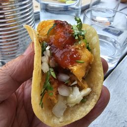 Fish taco with a bit of hot sauce