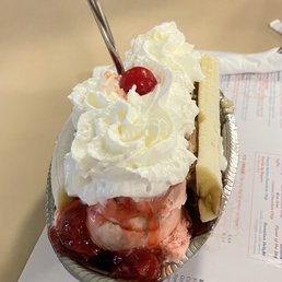 $10.99 | Banana Split - vanilla, choc., & strawberry ice cream, topped w/ pineapple, choc. & strawberry sauce, whipped cream, & a cherry