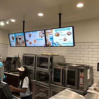 Cinnabon - a group of people working in a restaurant - Bakeries Near Me - Nashville, Tennessee