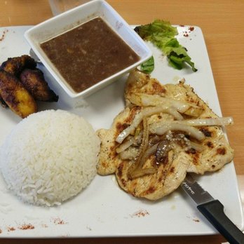 Cuba Bella Cafe - Garlic chicken (I already ate the tomato!) - Cuban Near Me - Carrollton, Texas Cuba Bella Cafe - Garlic chicken (I already ate the tomato!) - Cuban Near Me - Carrollton, Texas