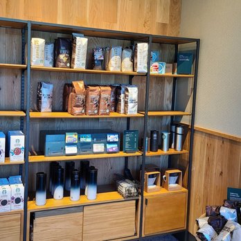 Starbucks - shelves of coffee and other items in a coffee shop - Coffee & Tea Near Me - Bloomington, Indiana Starbucks - shelves of coffee and other items in a coffee shop - Coffee & Tea Near Me - Bloomington, Indiana