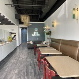 a restaurant with tables and booths