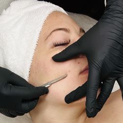 Lorelee Robinson - Colorado Waxing & Skin Care - Dermaplaning service being preformed