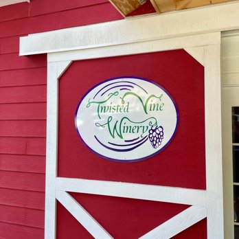 Twisted Vine Winery - a red barn with a sign for twisted vine winery - Wineries Near Me - Lenoir, North Carolina