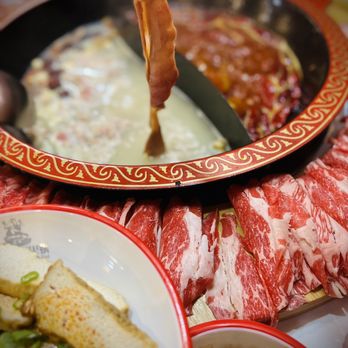 Pipa Mountain Hot Pot - a plate of food with chopsticks - Hot Pot Near Me - Seattle, Washington Pipa Mountain Hot Pot - a plate of food with chopsticks - Hot Pot Near Me - Seattle, Washington