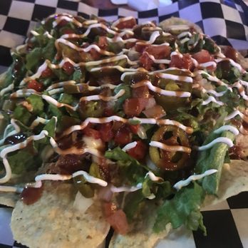 Crazy Craig's Cheeky Monkey Bar - Pork nachos!!! Lots of food. - Sports Bars Near Me - Branson, Missouri
