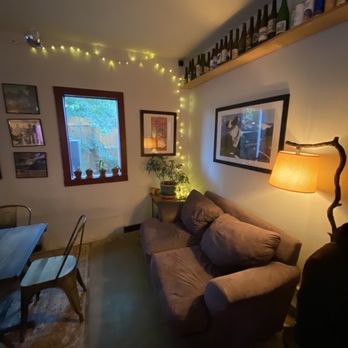 Knotted Root Brewing - a living room with a couch and a table - Breweries Near Me - Nederland, Colorado