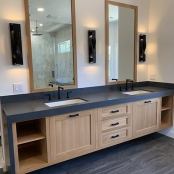 Willard Woodworks - a bathroom with two sinks and a large mirror - General Contractors Near Me - Norco, California Willard Woodworks - a bathroom with two sinks and a large mirror - General Contractors Near Me - Norco, California