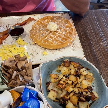 First Watch - the trifecta - waffles, bacon, eggs and a side order of seasoned potatoes. - Breakfast & Brunch Near Me - Pearland, Texas First Watch - the trifecta - waffles, bacon, eggs and a side order of seasoned potatoes. - Breakfast & Brunch Near Me - Pearland, Texas