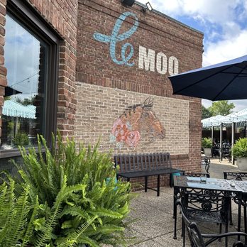 Le Moo - Outside patio and art from entrance - Steakhouses Near Me - Louisville, Kentucky