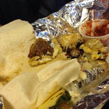Dancing Avocado Kitchen - The insides of a half eaten breakfast burrito. - Mexican Near Me - Daytona Beach, Florida