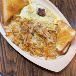 Luzader's 3 Girls Diner - Steak and cheese omelette with shredded hash-browns and toast.