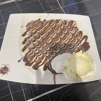 Melt n Dip - Crepe drizzled in 3 kinds of chocolate and scoop of vanilla ice cream - Creperies Near Me - Temple Terrace, Florida Melt n Dip - Crepe drizzled in 3 kinds of chocolate and scoop of vanilla ice cream - Creperies Near Me - Temple Terrace, Florida