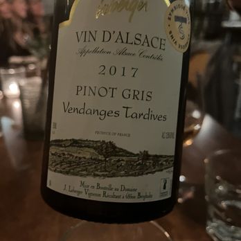 Sardines - a bottle of wine on a table - Seafood Near Me - Quebec City, Quebec Sardines - a bottle of wine on a table - Seafood Near Me - Quebec City, Quebec