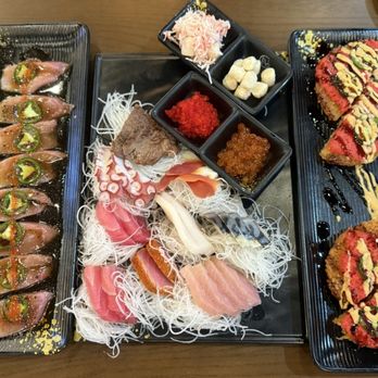East Blue Sushi - (Left To Right) YellowTail Jalapeño, Scallop Crab Salad, Scallop in Spicy Mayo, Red Tobiko, Salmon Roe, Steak Tataki. - Sushi Bars Near Me - San Antonio, Texas East Blue Sushi - (Left To Right) YellowTail Jalapeño, Scallop Crab Salad, Scallop in Spicy Mayo, Red Tobiko, Salmon Roe, Steak Tataki. - Sushi Bars Near Me - San Antonio, Texas