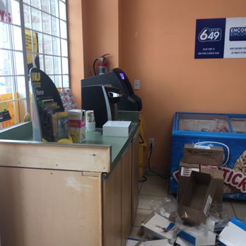 Hasty Market - a cash register and a pile of boxes on the floor - Convenience Stores Near Me - Brampton, Ontario