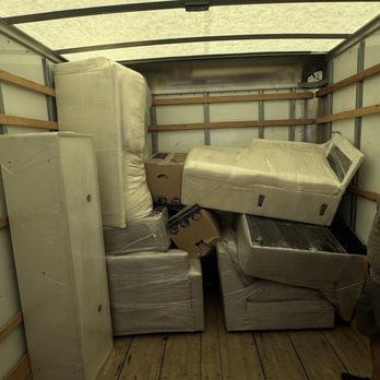 Muscular Moving Men and Storage - Boxes smashed between couches upside down. - Movers Near Me - Phoenix, Arizona Muscular Moving Men and Storage - Boxes smashed between couches upside down. - Movers Near Me - Phoenix, Arizona