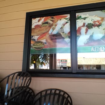 Achiote - Sigh on window outside patio waiting area. - Mexican Near Me - San Ysidro, California