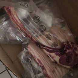 a box of meat wrapped in plastic a box of meat wrapped in plastic