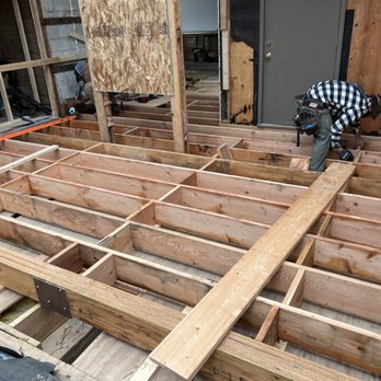 Melson Construction - a man working on framing a house - General Contractors Near Me Melson Construction - a man working on framing a house - General Contractors Near Me