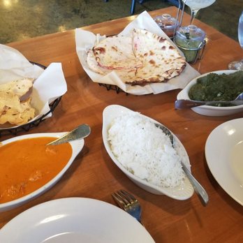Indian Twist - Tikka Chicken Massala, Peshwani Naan bread, Shrimp Saag, and rice - Indian Near Me - Tucson, Arizona Indian Twist - Tikka Chicken Massala, Peshwani Naan bread, Shrimp Saag, and rice - Indian Near Me - Tucson, Arizona