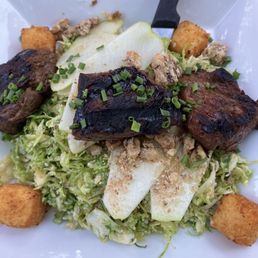 Brussel sprout salad with steak tips.