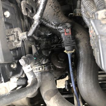 Take 5 Oil Change - coolant leak from tech trying to remove oil filter and cracking coolant housing - Oil Change Stations Near Me - Cypress, Texas Take 5 Oil Change - coolant leak from tech trying to remove oil filter and cracking coolant housing - Oil Change Stations Near Me - Cypress, Texas