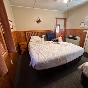 Convict Lake Resort - Bed area. Front door is just to the right of the foot of the bed. - Hotels Near Me - Mammoth Lakes, California