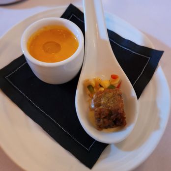 Circa 1886 Restaurant - Tomato soup topped with avocado lemon oil and a tasty fritter - New American Near Me - Charleston, South Carolina