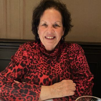 The Hot Spot - a woman sitting at a table - Portuguese Near Me - Roselle Park, New Jersey The Hot Spot - a woman sitting at a table - Portuguese Near Me - Roselle Park, New Jersey