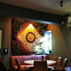 Wholesome Kitchen - Back Wall of Wholesome foods. Loved this art piece of nature and structure mixed together.  Lighting was soft and welcoming.