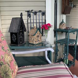 The Washington Street Inn - Front Porch Bird houses and a gliding couch like I had when I was growing up