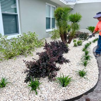 ELT Landscape - a man in orange shirt and hat working on landscaping - Landscaping Near Me - Plant City, Florida ELT Landscape - a man in orange shirt and hat working on landscaping - Landscaping Near Me - Plant City, Florida