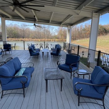 Three Sisters Vineyards - Covered deck with lake and vineyard views, perfect for enjoying your wine. - Wineries Near Me - Dahlonega, Georgia Three Sisters Vineyards - Covered deck with lake and vineyard views, perfect for enjoying your wine. - Wineries Near Me - Dahlonega, Georgia