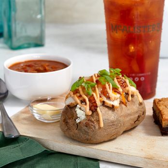 McAlister's Deli - a baked potato on a cutting board - Salad Near Me - Oak Ridge, Tennessee McAlister's Deli - a baked potato on a cutting board - Salad Near Me - Oak Ridge, Tennessee