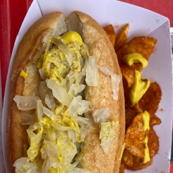Sommerfest - Brat with kraut. Spicy and Yellow mustard on top. Side of paprika chips and yellow mustard - German Near Me - Lake Buena Vista, Florida Sommerfest - Brat with kraut. Spicy and Yellow mustard on top. Side of paprika chips and yellow mustard - German Near Me - Lake Buena Vista, Florida